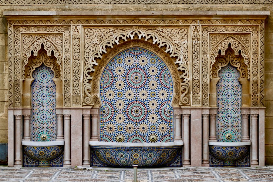 Traditional Moroccan blue architecture and terracotta tones of Marrakech at golden hour